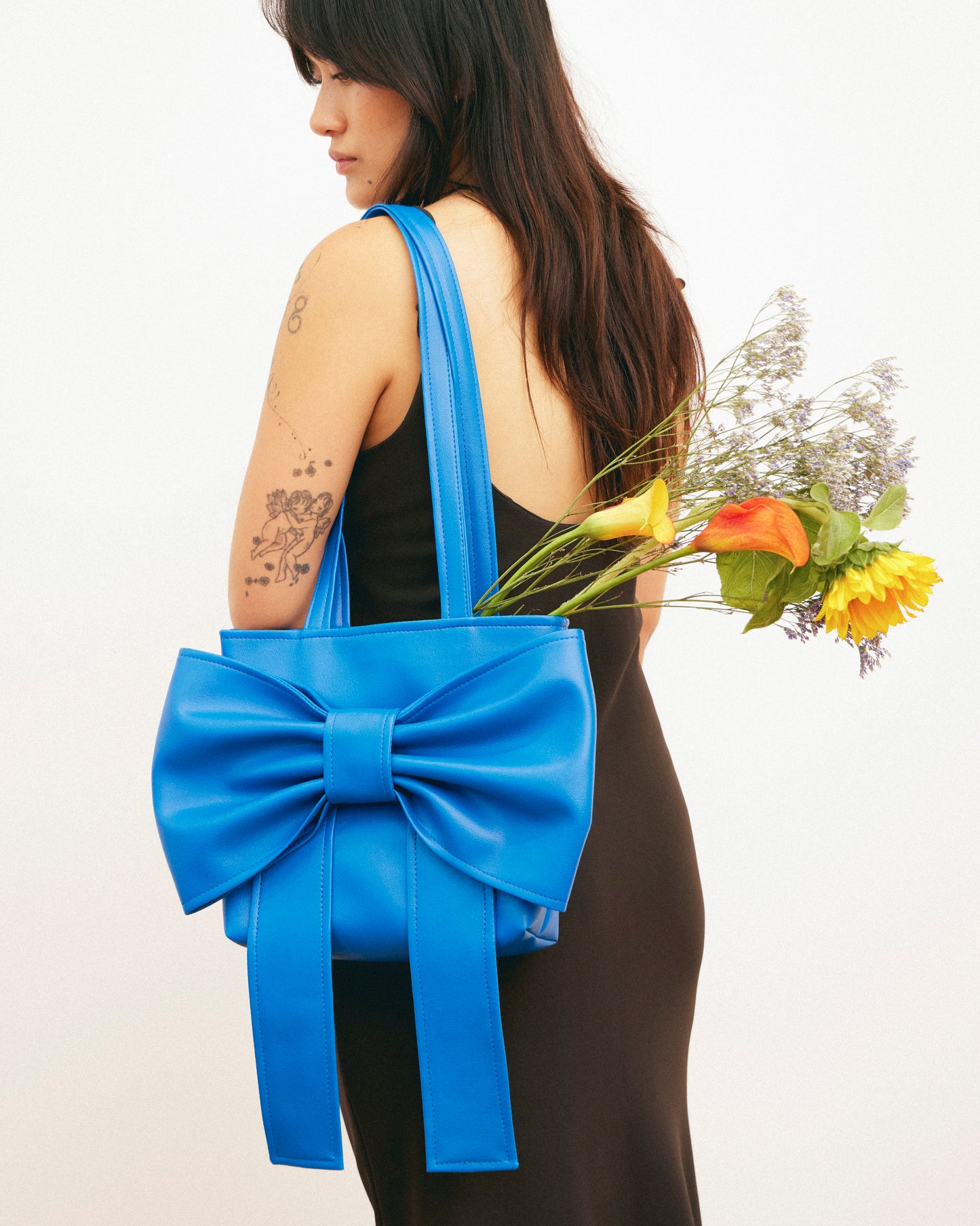 Caitlin Snell | Market Bag | Blue Bag | Leather | Vinyl | Bow Bag | Handmade | Ethical Fashion | Sustainable Fashion | Gift | New Zealand Made | Small Business | Natural Fibre | Durable | Chic | Hair Accessory | Slow Fashion