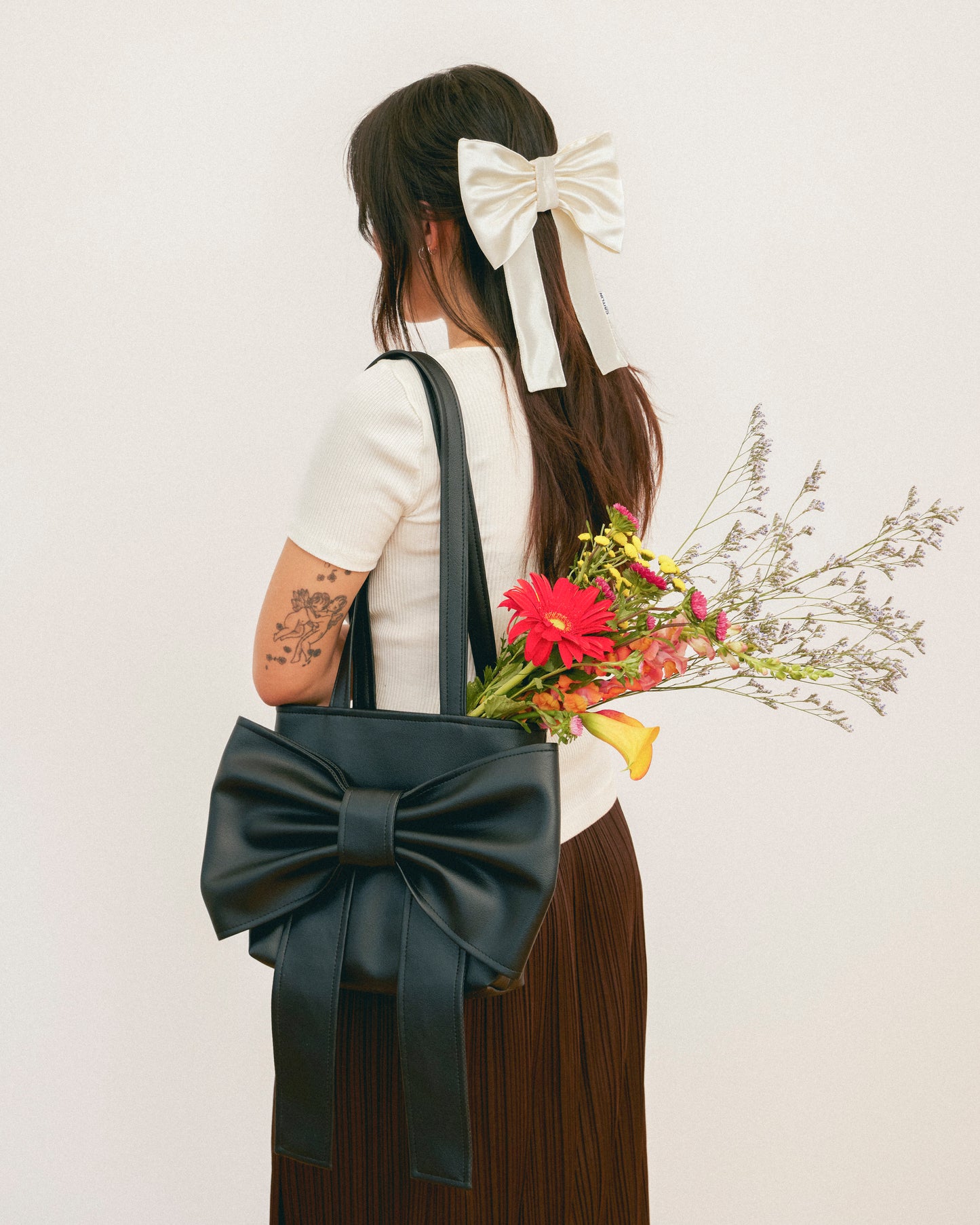 Caitlin Snell | Market Bag |  Leather | Vinyl | Bow Bag | Handmade | Ethical Fashion | Sustainable Fashion | Gift | New Zealand Made | Small Business | Natural Fibre | Durable | Chic | Hair Accessory | Slow Fashion 